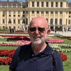 Henk at Schönbrunn, in front of the palace flowerbeds.